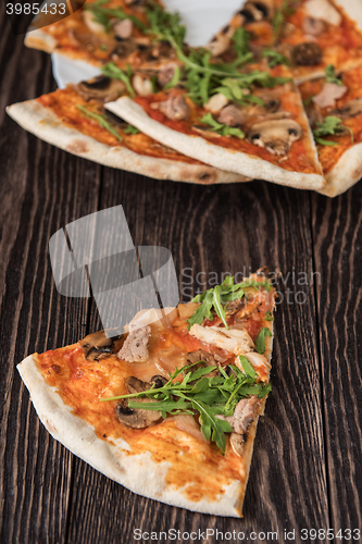 Image of Pizza with chicken and mushrooms