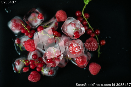 Image of Frozen berries on wooden table