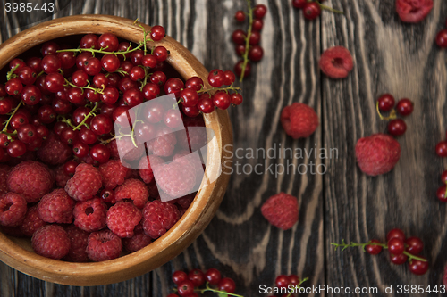 Image of Fresh berries on wooden table