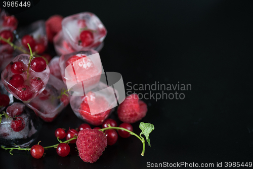 Image of Frozen berries on wooden table