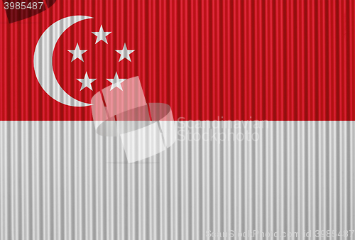 Image of Flag on corrugated iron