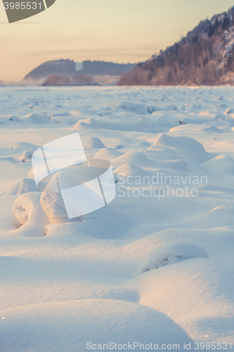 Image of landscape. weather, snowdrifts in the foreground