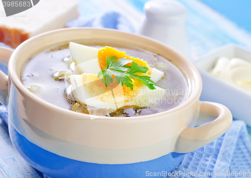 Image of green soup with boiled eggs