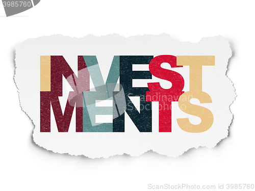 Image of Currency concept: Investments on Torn Paper background