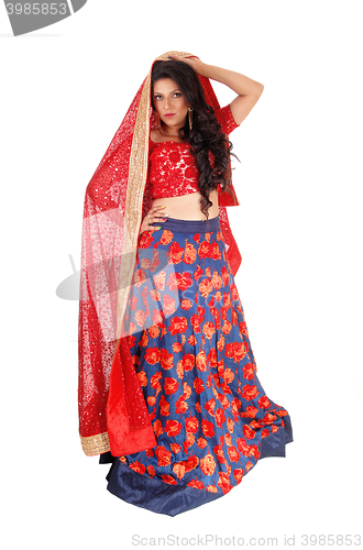 Image of Woman in long colorful dress.