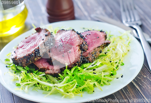 Image of beef steak with fresh salad