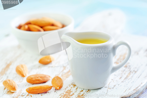 Image of almond essential oil and almond in bowl