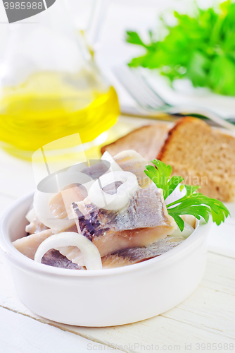 Image of herring with onion