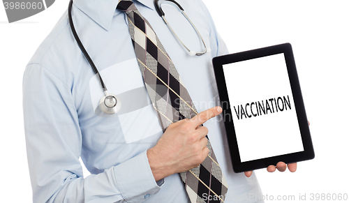 Image of Doctor holding tablet - Vaccination