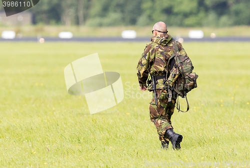 Image of LEEUWARDEN, THE NETHERLANDS - JUNE 9; Military guard walking at 