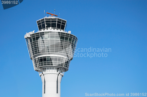 Image of Munich air traffic control tower against clear blue sky 
