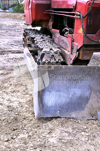 Image of Old caterpillar bulldozer working on construction site