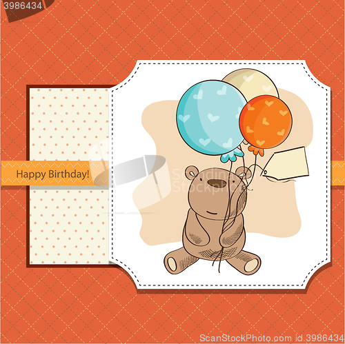 Image of birthday card with teddy bear and balloons