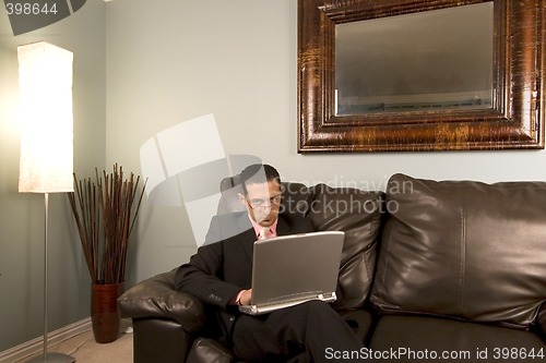 Image of Home or Office - Businessman Working on the Couch