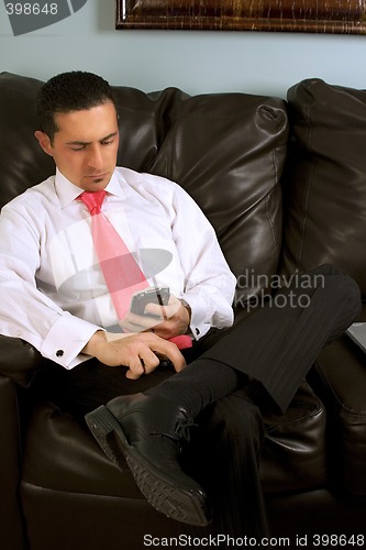 Image of Businessman Looking at his PDA