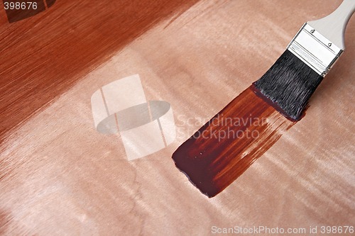 Image of Fresh paint on wooden surface