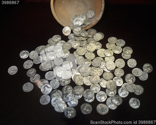 Image of silver coins on black