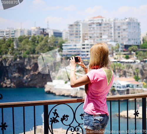 Image of young woman with camera