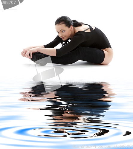 Image of fitness in black leotard on white sand #2