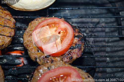 Image of Barbequing hamburgers