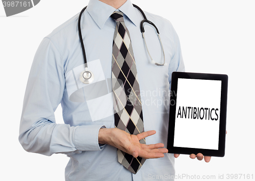Image of Doctor holding tablet - Antibiotics