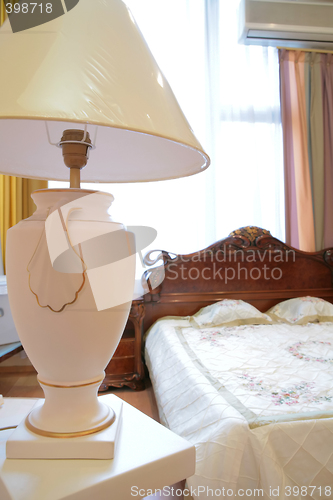 Image of antique lamp in luxurious bedroom