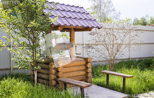 Image of Wooden well with buckets for water.