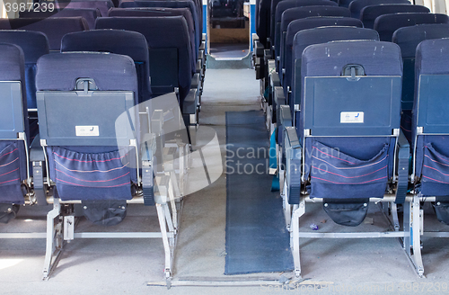 Image of Empty old airplane seats in the cabin, selective focus