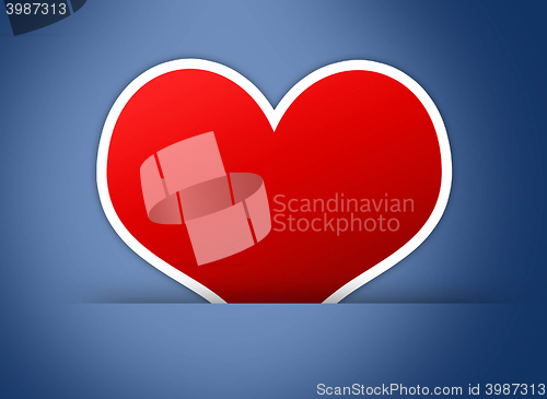 Image of Red heart on blue back ground