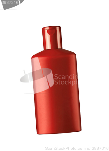 Image of red cosmetic bottle isolated on the white