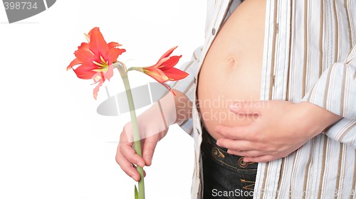 Image of expectant mother with flower