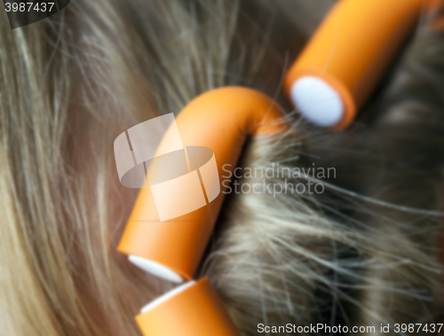 Image of curlers in her hair