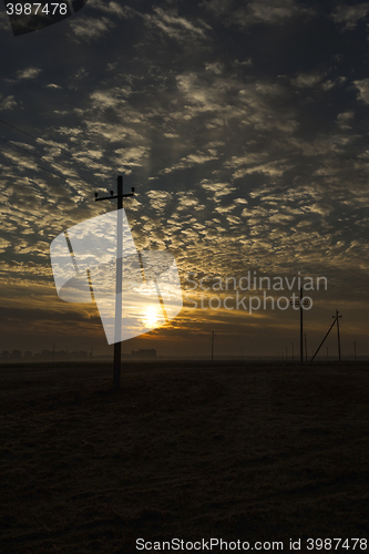 Image of power poles in the field