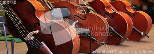 Image of four old bass viols