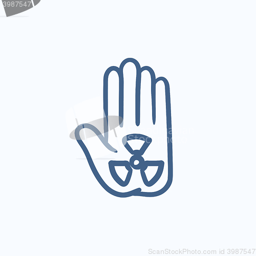 Image of Ionizing radiation sign on a palm sketch icon.