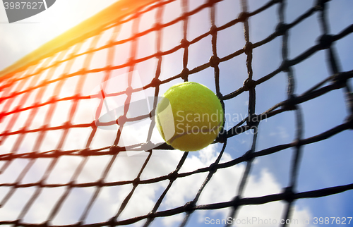 Image of tennis ball on a tennis court