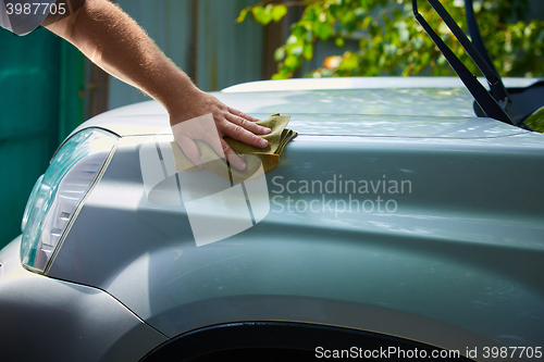 Image of Close-up Of Hand With green Brush Washing Car