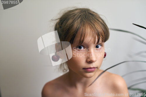 Image of Little girl with a cherry on her ears