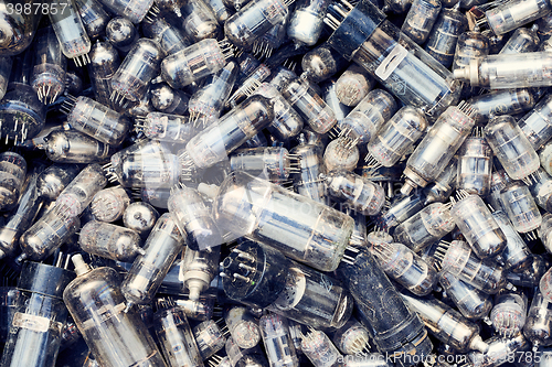 Image of Top view heap of old glass vacuum radio tubes