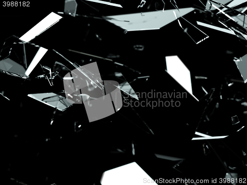 Image of Pieces of splitted or cracked glass on black