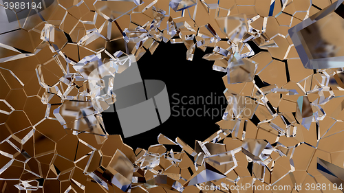 Image of Shattered glass: sharp Pieces and hole on black