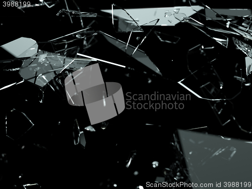 Image of Many pieces of shattered glass over black