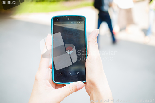 Image of Moscow, Russia - August, 02: Android user play in Pokemon Go augmented reality mobile game on smartphone.