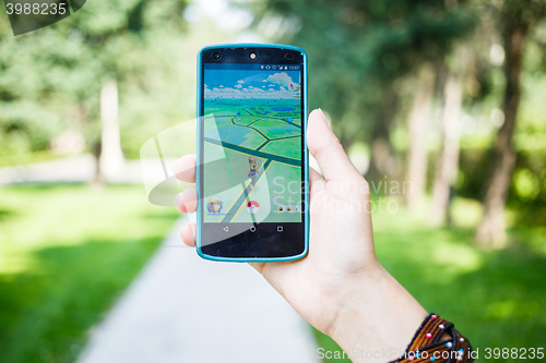 Image of Moscow, Russia - August, 02: Android user play in Pokemon Go augmented reality mobile game on smartphone.