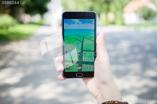 Image of Moscow, Russia - August, 02: Android user play in Pokemon Go augmented reality mobile game on smartphone.