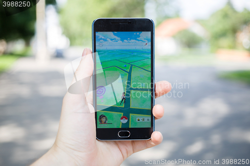 Image of Moscow, Russia - August, 02: Android user play in Pokemon Go aug