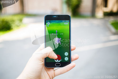 Image of Moscow, Russia - August, 02: Android user play in Pokemon Go aug