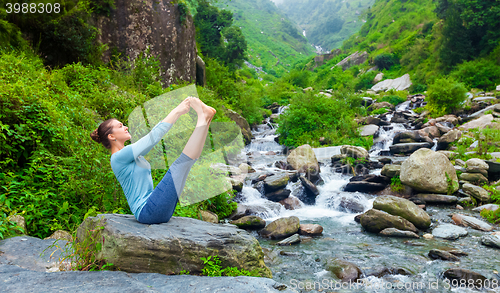 Image of Woman doing Ashtanga Vinyasa Yoga asana outdoors