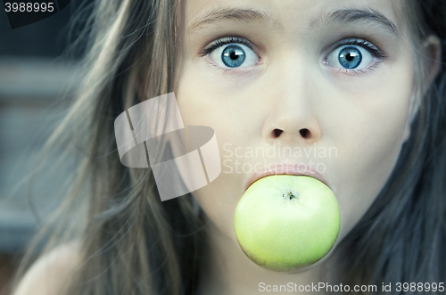 Image of Little Girl With Green Apple