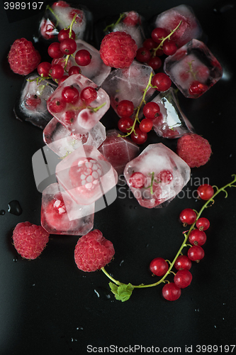 Image of Frozen berries on wooden table